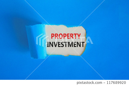 Property investment symbol. Concept words Property investment on beautiful white paper. Beautiful blue paper background. Business Property investment concept. Copy space. 117689920