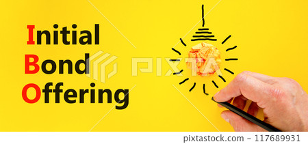 IBO initial bond offering symbol. Concept words IBO initial bond offering on beautiful paper. Beautiful yellow background. Businessman hand. Business IBO initial bond offering concept. Copy space 117689931