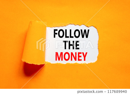 Follow the money symbol. Concept words Follow the money on beautiful white paper. Beautiful orange paper background. Business and follow the money concept. Copy space. 117689940
