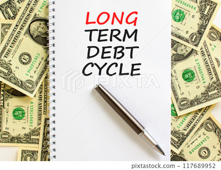 Long term debt cycle symbol. Concept words Long term debt cycle on beautiful white note. Black pen. Beautiful dollar bills background. Dollar bills. Business Long term debt cycle concept. Copy space Long term debt cycle symbol. Concept words Long term debt cycle on beautiful white note. Black pen. Beautiful dollar bills background. Dollar bills. Business Long term debt cycle concept. Copy space 117689952