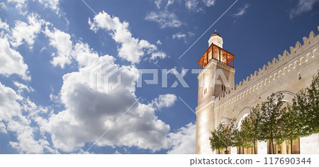 King Hussein Bin Talal mosque in Amman (at night), Jordan.  Against the background of a beautiful sky with clouds 117690344