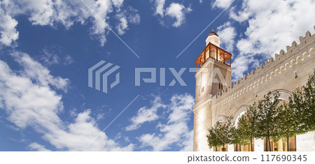 King Hussein Bin Talal mosque in Amman (at night), Jordan.  Against the background of a beautiful sky with clouds 117690345