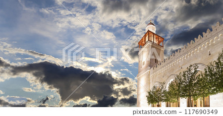 King Hussein Bin Talal mosque in Amman (at night), Jordan. Against the background of a beautiful sky with clouds King Hussein Bin Talal mosque in Amman (at night), Jordan. Against the background of a beautiful sky with clouds 117690349