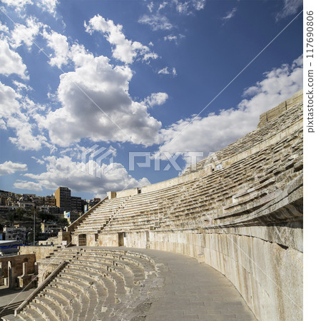 Roman Theatre in Amman, Jordan -- theatre was built the reign of Antonius Pius (138-161 CE), the large and steeply raked structure could seat about 6000 people. Against the sky with clouds 117690806