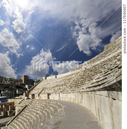 Roman Theatre in Amman, Jordan -- theatre was built the reign of Antonius Pius (138-161 CE), the large and steeply raked structure could seat about 6000 people. Against the sky with clouds 117690807