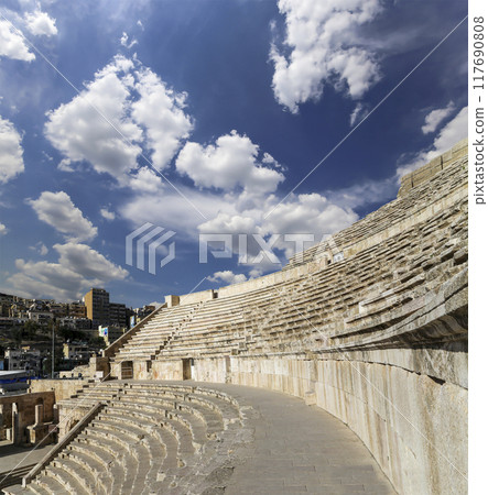 Roman Theatre in Amman, Jordan -- theatre was built the reign of Antonius Pius (138-161 CE), the large and steeply raked structure could seat about 6000 people. Against the sky with clouds 117690808