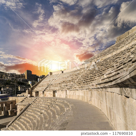 Roman Theatre in Amman, Jordan -- theatre was built the reign of Antonius Pius (138-161 CE), the large and steeply raked structure could seat about 6000 people. Against the sky with clouds 117690810