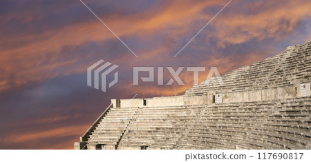 Roman Theatre in Amman, Jordan -- theatre was built the reign of Antonius Pius (138-161 CE), the large and steeply raked structure could seat about 6000 people. Against the sky with clouds 117690817