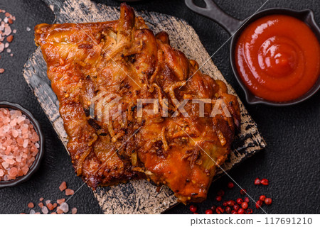 Delicious juicy grilled ribs with honey and mustard sauce with salt, spices and herbs 117691210