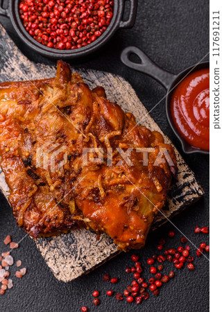 Delicious juicy grilled ribs with honey and mustard sauce with salt, spices and herbs Delicious juicy grilled ribs with honey and mustard sauce with salt, spices and herbs 117691211