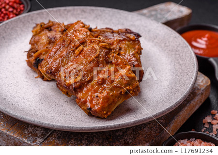 Delicious juicy grilled ribs with honey and mustard sauce with salt, spices and herbs Delicious juicy grilled ribs with honey and mustard sauce with salt, spices and herbs 117691234