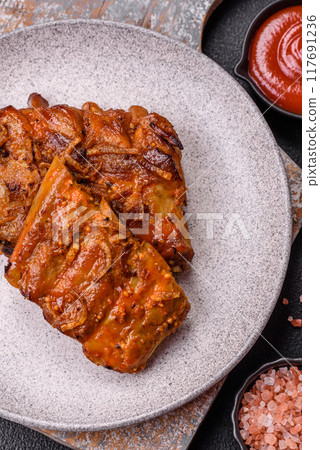 Delicious juicy grilled ribs with honey and mustard sauce with salt, spices and herbs Delicious juicy grilled ribs with honey and mustard sauce with salt, spices and herbs 117691236