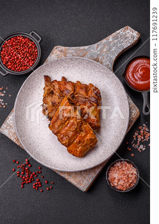 Delicious juicy grilled ribs with honey and mustard sauce with salt, spices and herbs 117691239