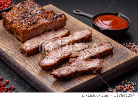 Fresh juicy delicious beef steak on a dark background 117691294