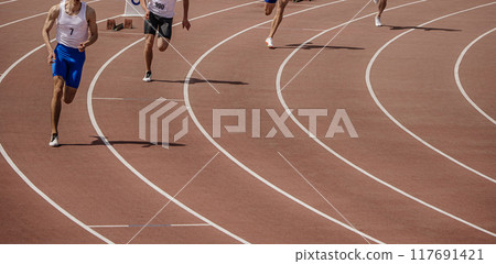 start group of athletes sprint race at stadium, athletics competition start group of athletes sprint race at stadium, athletics competition 117691421