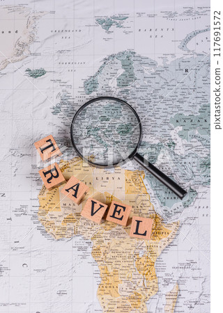 Conceptual background for travel with passport, magnifying glass, world map and money Conceptual background for travel with passport, magnifying glass, world map and money 117691572