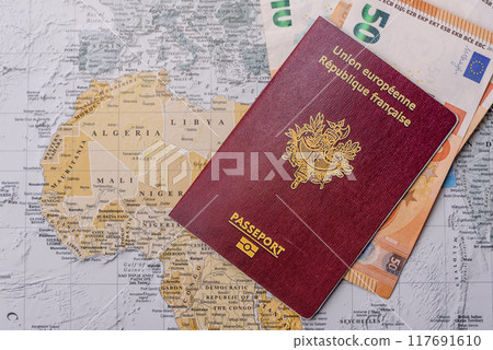 Conceptual background for travel with passport, magnifying glass, world map and money Conceptual background for travel with passport, magnifying glass, world map and money 117691610