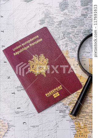 Conceptual background for travel with passport, magnifying glass, world map and money Conceptual background for travel with passport, magnifying glass, world map and money 117691613