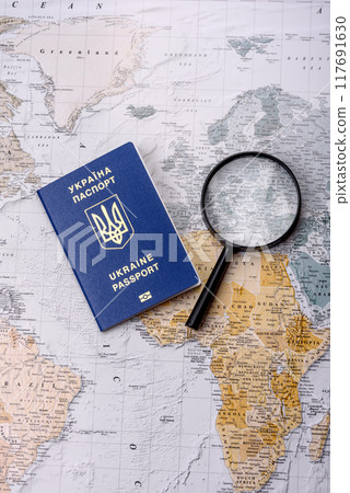 Conceptual background for travel with passport, magnifying glass, world map and money 117691630