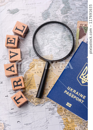 Conceptual background for travel with passport, magnifying glass, world map and money Conceptual background for travel with passport, magnifying glass, world map and money 117691635