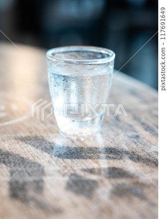 Small glas of Ouzo, a Greek aperitif alcoholic drink, Dahme, Germany 117691649
