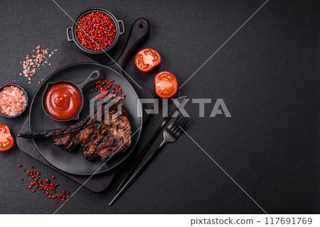 Juicy grilled beef tomahawk steak with salt, spices and herbs Juicy grilled beef tomahawk steak with salt, spices and herbs 117691769