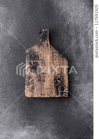 Empty wooden cutting board. Kitchen utensils 117691920