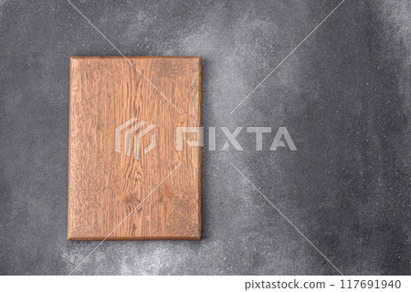 Empty wooden cutting board. Kitchen utensils Empty wooden cutting board. Kitchen utensils 117691940