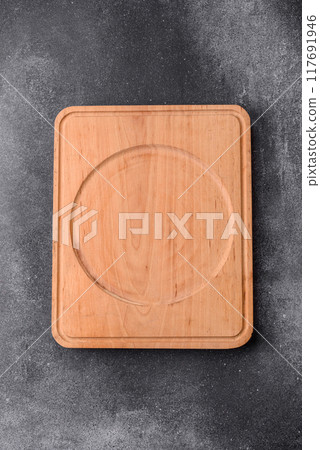Empty wooden cutting board. Kitchen utensils Empty wooden cutting board. Kitchen utensils 117691946