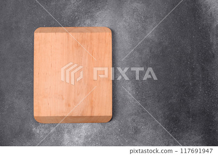 Empty wooden cutting board. Kitchen utensils 117691947