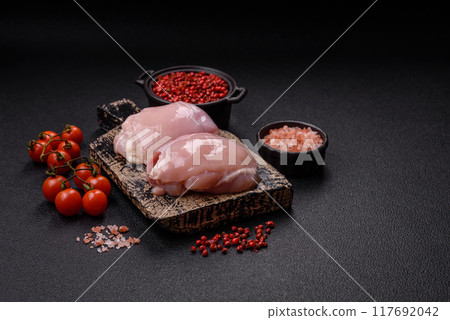 Fresh chicken fillet on a dark concrete table with spices and herbs 117692042