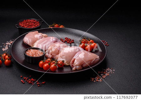 Fresh chicken fillet on a dark concrete table with spices and herbs 117692077