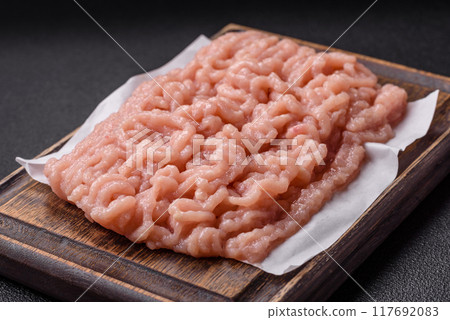 Fresh raw chicken mince with salt and spices 117692083