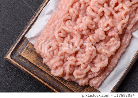 Fresh raw chicken mince with salt and spices Fresh raw chicken mince with salt and spices 117692084