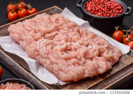 Fresh raw chicken mince with salt and spices Fresh raw chicken mince with salt and spices 117692086