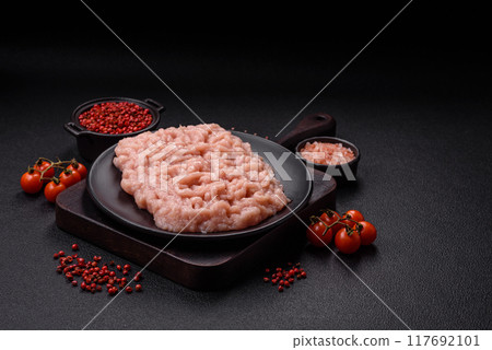 Fresh raw chicken mince with salt and spices 117692101