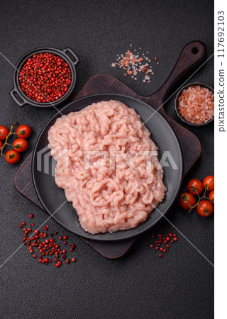 Fresh raw chicken mince with salt and spices Fresh raw chicken mince with salt and spices 117692103
