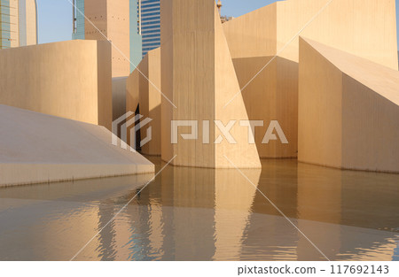 A city skyline in Abu Dhabi with a modern-looking park A city skyline in Abu Dhabi with a modern-looking park 117692143