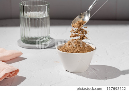 Collagen protein glow powder drink. Glass of collagen beauty drink. Food supplement. Collagen protein glow powder drink. Glass of collagen beauty drink. Food supplement. 117692322