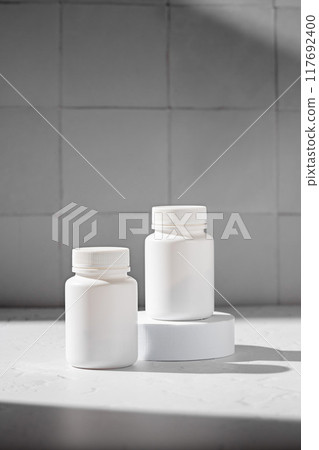 Food supplement concept. Bottles with capsules of probiotics, vitamins Food supplement concept. Bottles with capsules of probiotics, vitamins 117692400