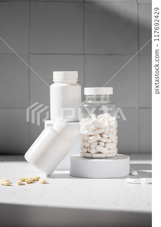 White pill bottles. Health care food supplements, vitamins and medicaments White pill bottles. Health care food supplements, vitamins and medicaments 117692429