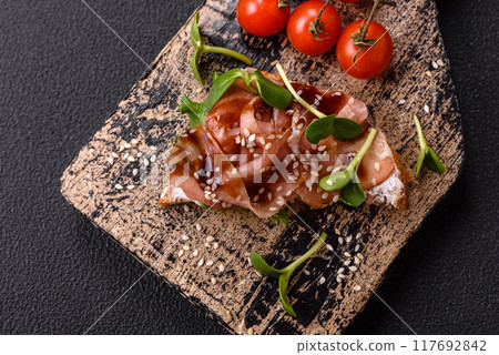 Variation of several toasts or bruschetta with prosciutto, mushrooms and veal Variation of several toasts or bruschetta with prosciutto, mushrooms and veal 117692842