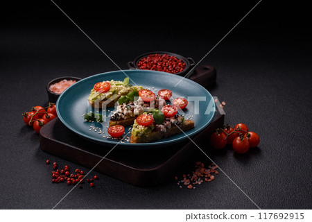 Crispy sandwich or bruschetta with guacamole, tuna and flax seeds 117692915