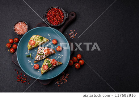 Crispy sandwich or bruschetta with guacamole, tuna and flax seeds 117692916