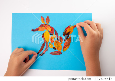 Fox made of leaf on blue background, autumn craft for kid, animal clip art collage made of dry dead leaves, fall DIY project, nature-inspired artwork, creative children's activity, eco-friendly art 117693612