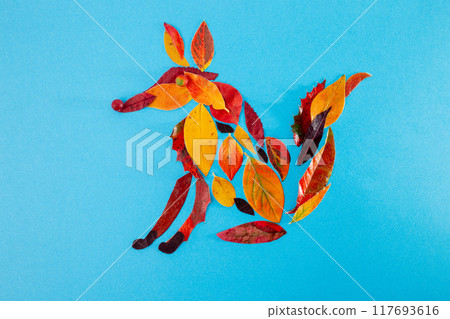 fox made of leaf on blue background, autumn craft for kid, animal clip art collage made of dry dead leaves, fall DIY, 117693616