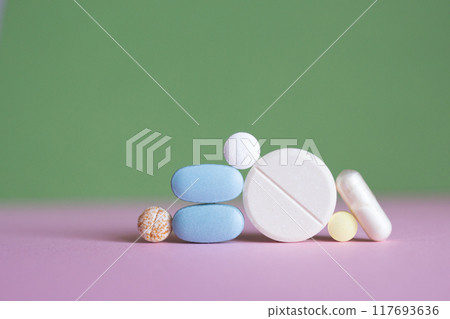 Pills on table, Suitable for healthcare, medication, and pharmaceutical topics, blending medical imagery with artistic design. minimalist Pills on table, Suitable for healthcare, medication, and pharmaceutical topics, blending medical imagery with artistic design. minimalist 117693636