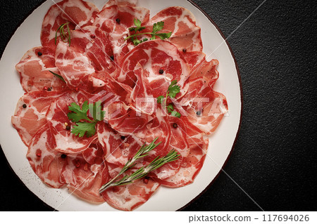 sliced cured ham, prosciutto, italian dish, delicacy, parma ham, top view, no people, 117694026