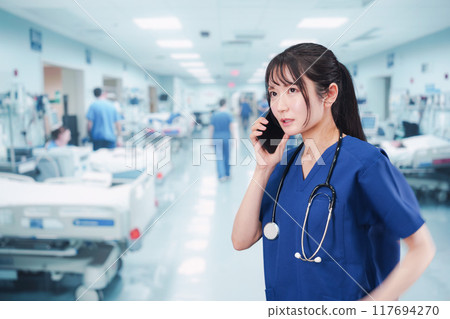 A young female doctor busy dealing with an emergency case 117694270