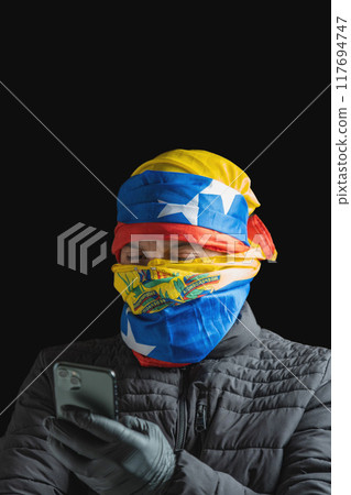 Symbol of repression, hooded fighting for freedom, resistance for democracy in Venezuela, violation of human rights 117694747